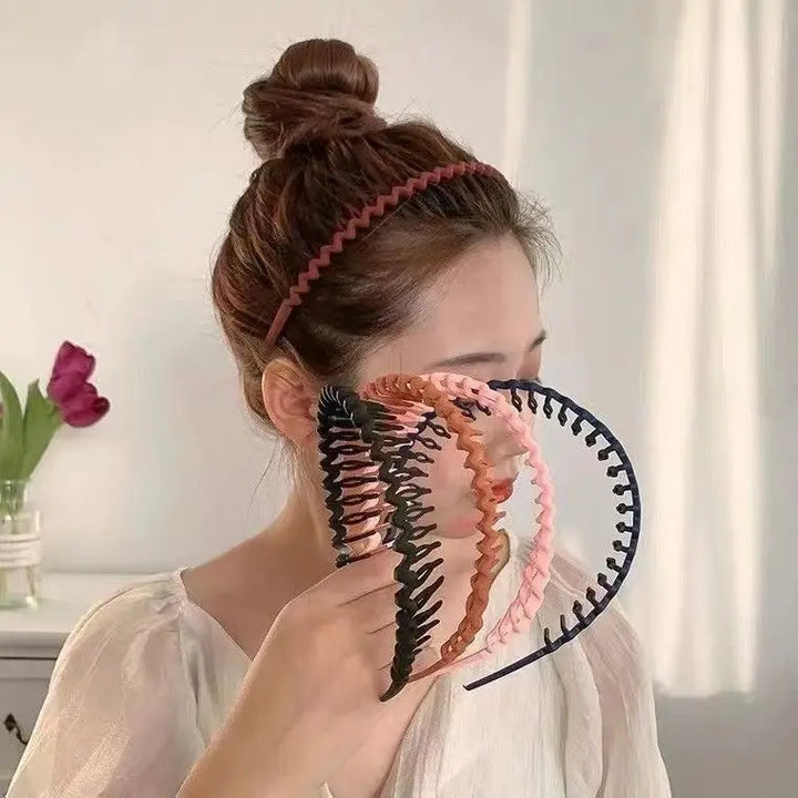 headband, female model with broken and jagged hair artifact